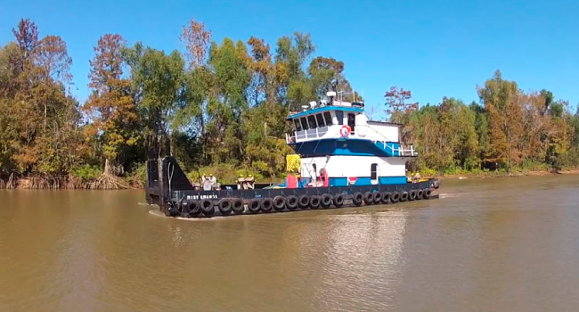 Image of tugboat on bayou in Louisiana &mdash; screenshot from Carson Energy video produced by PWG Media.